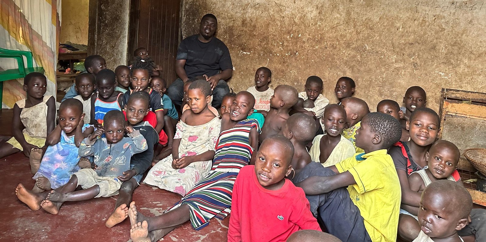 Pastor Nyanzi Leon with children